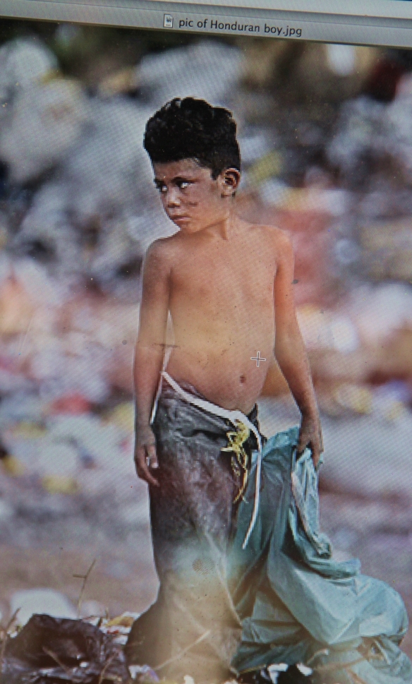 The piece Oscar-Alberto Bogran was painting on Market Street Friday is based on this photo of a poverty-stricken boy in Honduras, the country where Oscar was born. 